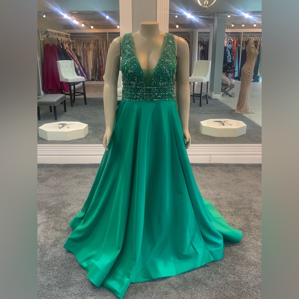 size 24w. jeweled top. deep v cut front. slit. pockets. emerald